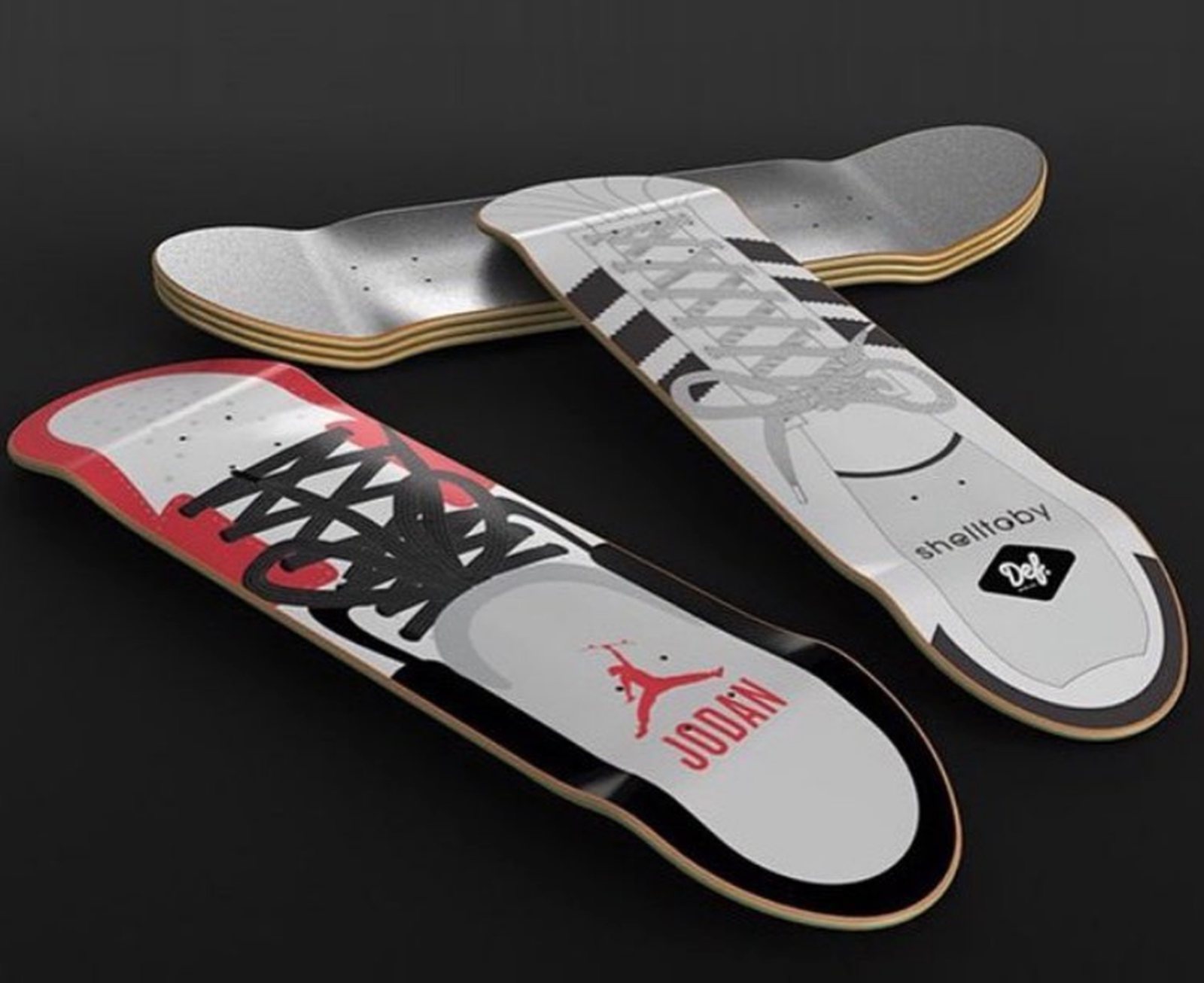 Three Tatsie decks rendered on a dark background: a Jordan-style shoe deck, the Def Shell Toby deck and a blank deck
